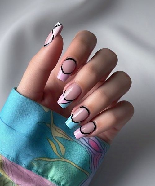 16. A Creative Hand In Artistic Long Sleeves, Featuring French Tip Nail Designs With An Extra Line Below The Traditional Tip In A Contrasting Color, Adding Depth And A Unique Twist To The Classic Manicure