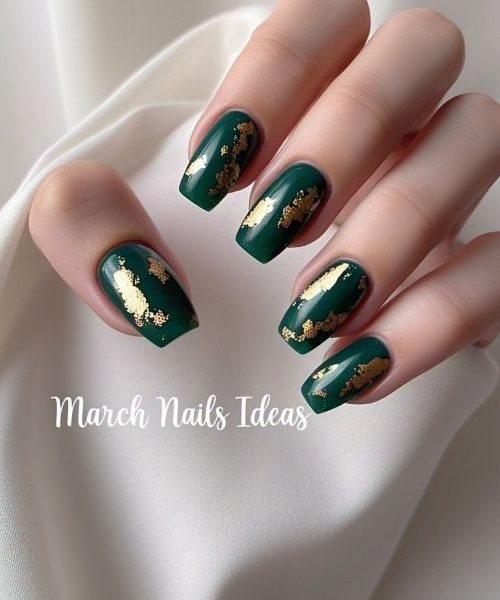 3. A Stylish Hand In Long Sleeves, Flaunting March Nails Ideas With Deep Emerald Green Nails Accented By Delicate Gold Foil, Exuding Sophistication